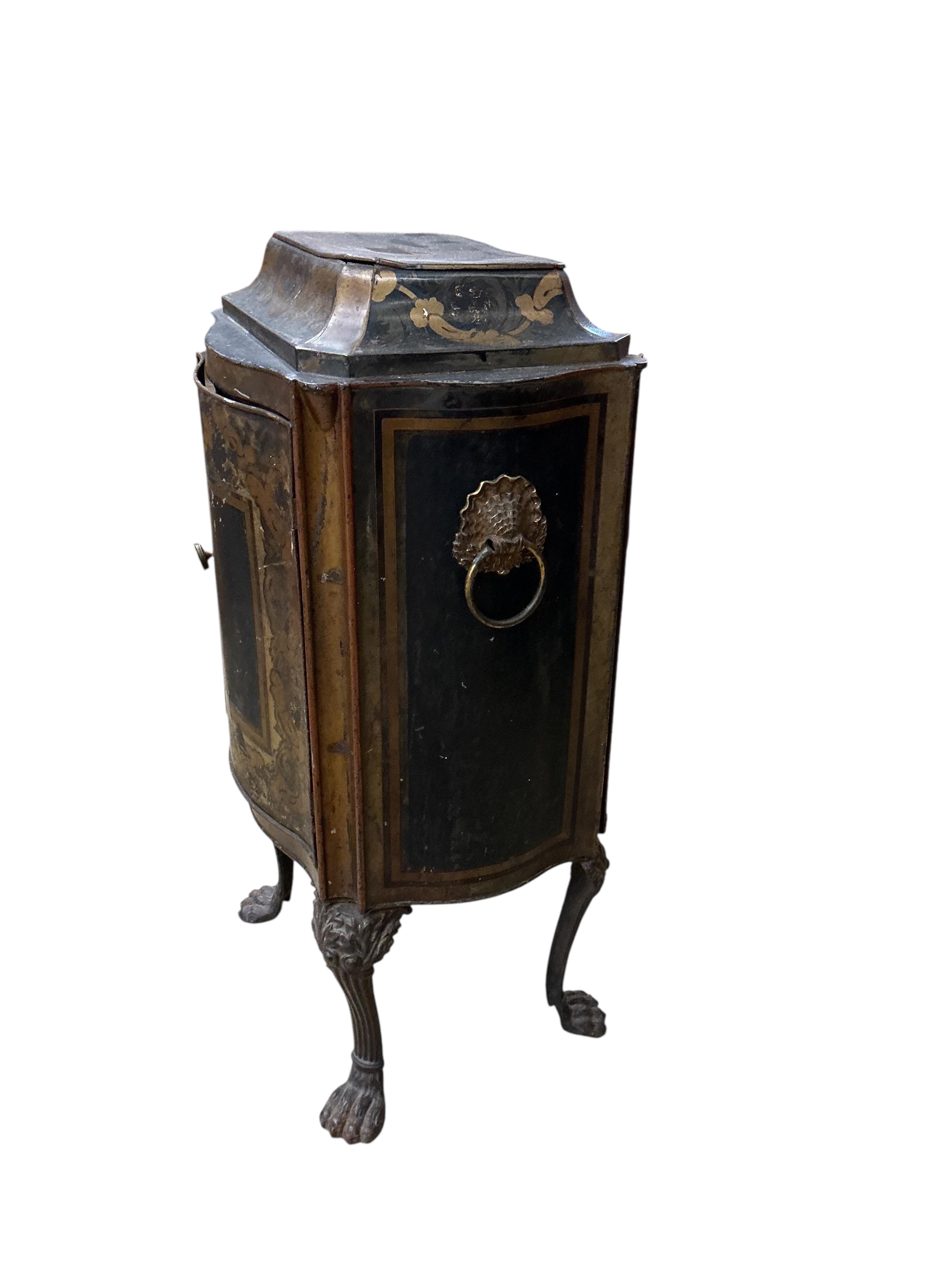 An early 19th century toleware serpentine cabinet, with gilt decoration, width 40cm, depth 30cm, height 76cm